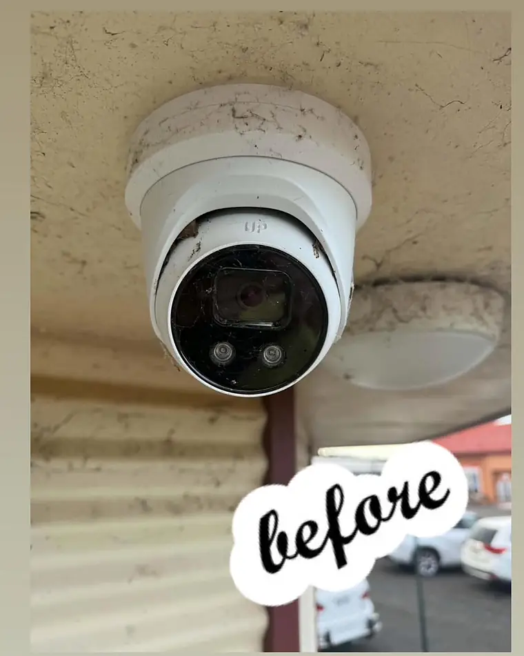 A dusty dome camera before cleaning