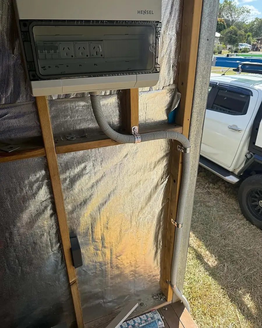 A weatherproof temporary switchboard mounted on a renovation frame