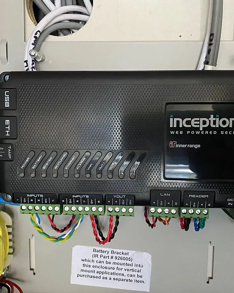 An Inner Range Inception security controller wired into its enclosure