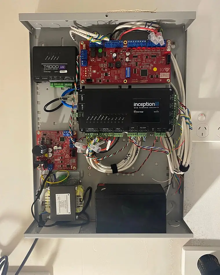 A security panel enclosure with the controller, expansion boards and backup battery