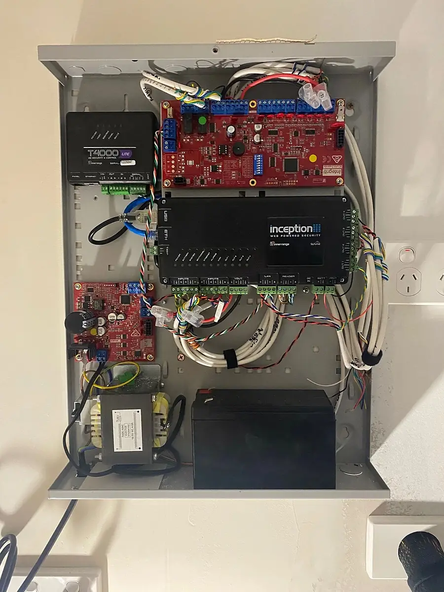 A security panel enclosure with the controller, expansion boards and backup battery
